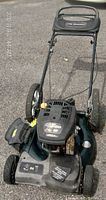 Full view of Yard Works lawnmower showing general condition and design.