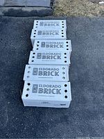 Four closed boxes of Eldorado Brick with branding visible on the boxes.