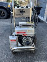 Front view of Mack 3000 Pro pressure washer showing engine, pump assembly and brand logo