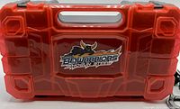 Closed red translucent plastic BeyWarriors Shogun Steel carrying case with handle and logo.