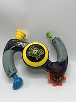 Front perspective of the Bop It Extreme 2 game showing all interactive controls and branding.