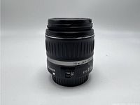 Front view of Canon EFS 18-55mm lens with aperture ring and AF/MF switch.