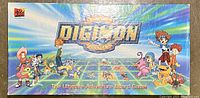 Box cover featuring Digimon characters and logo stating 'The Ultimate Adventure Board Game'