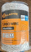 Close-up photo of Gallagher Turbo Wire packaging front showing brand, wire length 656ft/200m, wire diameter 2.5mm/3/32, heavy duty label, and wire strand details.