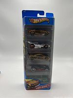 Front view of unopened Hot Wheels Street Beasts set showing five cars vertically stacked in their package.