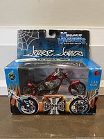 Front view of the Muscle Machines Jessie Jones die cast motorcycle in original packaging, showing the model and branding clearly.