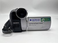 Front view of Sony Handycam DCR-HC28 showing Carl Zeiss Lens, Handycam branding, and 20x optical zoom.