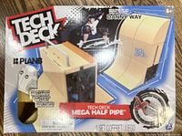 Front box of Tech Deck Mega Half Pipe set showing the brand, pro skateboarder Danny Way endorsement, and image of the assembled half pipe playset