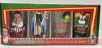 Front view of box showing four wide mouth ball glasses with full-color Elf movie scenes.