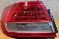 Front view of the red and clear lens taillight illustrating the lighting panel and condition.