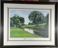 Full view of the framed print showing the golf course and water feature with trees.