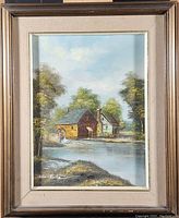 Framed original oil on canvas painting by Brian Roche depicting a landscape with a watermill, river, and trees under a partly cloudy sky.