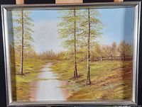 Full view of the original landscape oil painting with simple frame.