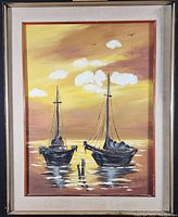 Framed oil painting of two moored sailboats with sunset sky and water reflections.
