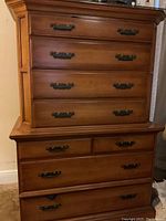 Front view of the hardwood high boy dresser showing all drawers and hardware.