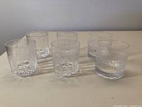 Photo of all 6 glasses showing 4 smaller old fashioned and 2 larger double old fashioned glasses with textured glass patterns