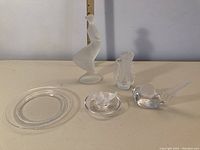 Full view of all five glass decor items showing frosted doves, clear plate, and ornaments