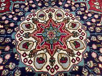 Close‐up of central medallion on red field