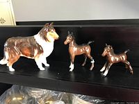 Three ceramic figurines: Royal Doulton collie and two Beswick ponies