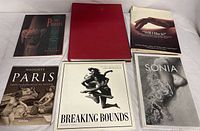 Six photography art books spread on white background, titles and covers visible for identification