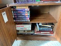 Shelf with various VHS tapes and books including Future Youth, and some partially visible titles.