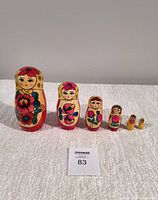 Front view of the 6-piece Matryoshka doll set showing detailed hand-painted faces and floral designs.