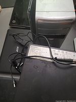 Five computers in total: three laptops and two desktops. Hard drives removed, condition unknown.