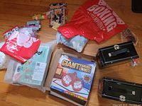 Overview photo showing the entire collection including boxed toy, boxing gloves, pin set, cash box and bags of items