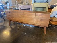 Front view showing drawers and cabinet doors