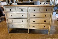 Full front view of the dresser showing ten drawers and overall finish.