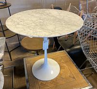 Front view of round marble top and pedestal base
