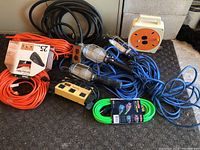 Full lot showing all extension cords, work lights, power bar, and portable cord reel
