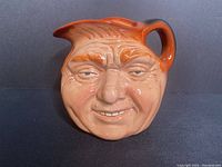 Front view of the John Barleycorn Toby Jug showing face details and glaze.