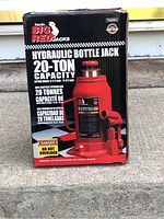 Photo of the original box showing 'Torin Big Red Hydraulic Bottle Jack 20-Ton Capacity' label and safety warnings.