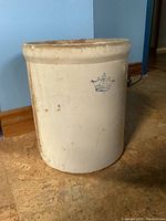 Front view of stoneware crock showing crown marking and number 3.