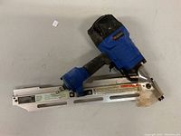 Top-down view of entire framing nailer laid flat