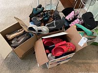 Four boxes of assorted women's shoes including Crocs and slippers in various colors and styles, mostly size 39/40 (8.5/9).