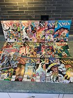 Front view of 17 Classic X-Men comics laid out in partial grid showing colorful covers with characters and action scenes.