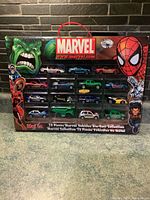 Front view of sealed Marvel Maisto die-cast 15-vehicle collector set in original packaging showing Marvel logo, Hulk and Spider-Man artwork