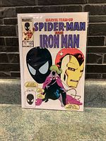 Photo of Marvel Team-Up Spider-Man and Iron Man Issue 145 comic book front cover showing character art and publication details.