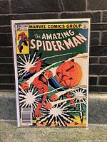 Front cover photo of The Amazing Spider-Man issue number 244 comic book showing Spider-Man with pumpkin bombs, Marvel Comics Group label, 75 cent price, and date September 1983.