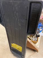 Top view of Kangaroo branded black plastic rolling mechanic's creeper