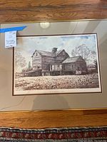 Framed print of Barn Near Hockessin showing overall artwork and gold frame with crack in glass.
