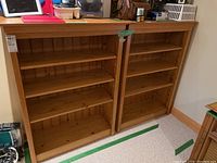 Front view of both pine bookshelves side by side