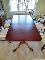 Overhead view of table with single leaf inserted, showing tabletop surface
