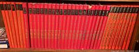 Front view of Popular Mechanics Do-It-Yourself Encyclopedia volumes showing years 1974 to 1980 and several volumes lined up on shelf