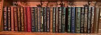 Shelf of Reader's Digest novels including Moby Dick, Oliver Twist, The Call of the Wild and Great Canadian Adventures.
