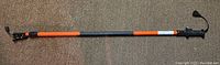 Full length view of telescoping pole saw extension pole