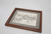 Framed vintage black and white drawing laid flat on a white background, showing full frame and mat