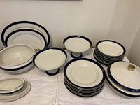 Overview of all pieces including soup bowls, plates, platters, compotes, gravy boat, covered and open vegetable dishes